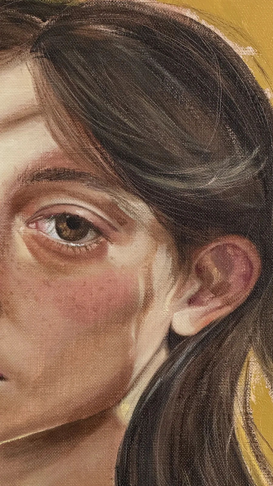 Detail: eye, freckles and the canvas weave