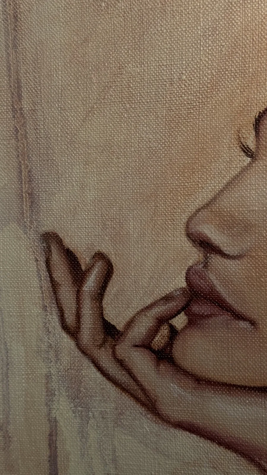 Close-up of the fingers against her lips