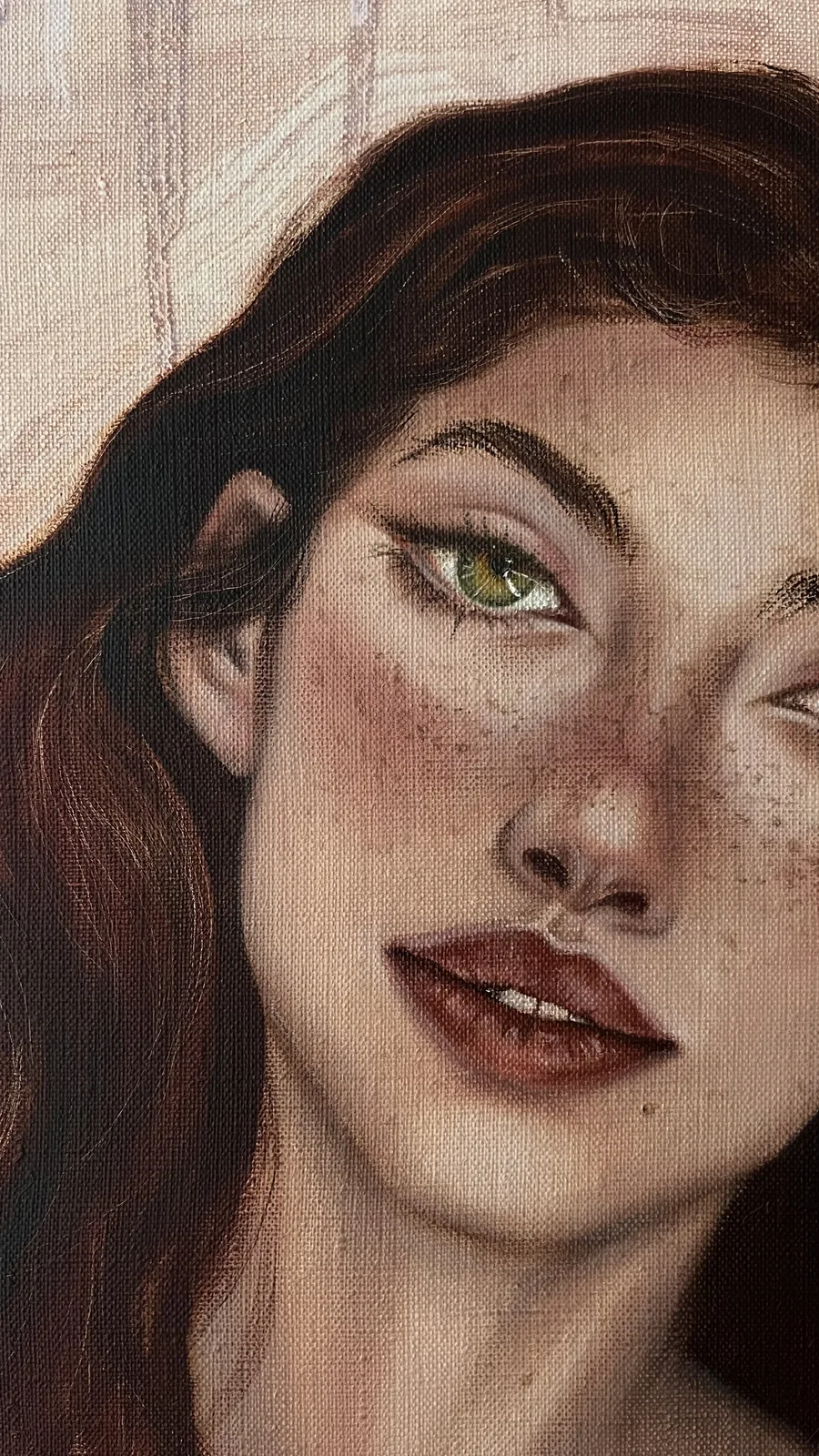 Close-up of the face: green eyes, freckles and parted lips