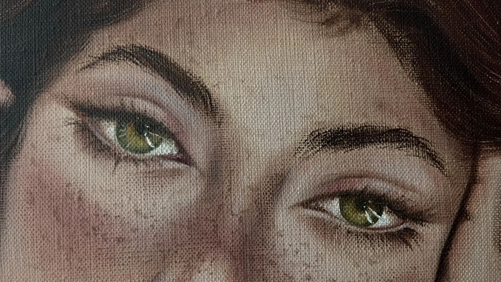 Detail: green eyes and freckles, the linen weave visible