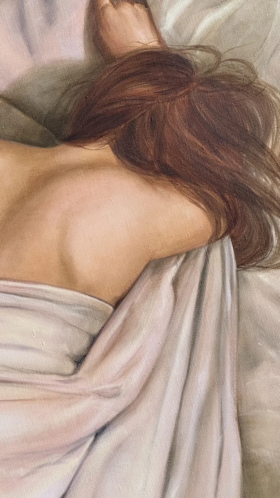 Detail: auburn hair spilling over the shoulder