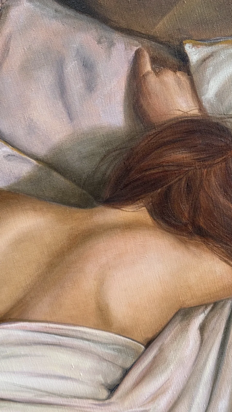 Detail: the hand on the pillow and the curve of the shoulder