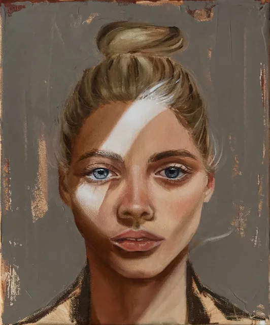 Portrait of a fair-haired woman with a band of sunlight across her face