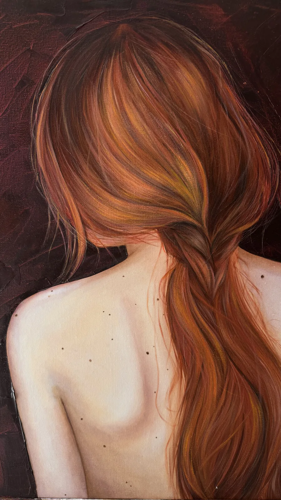 The canvas photographed close: the back, the braid and the deep red ground